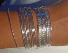 Load image into Gallery viewer, Set of 25 light silver bangles