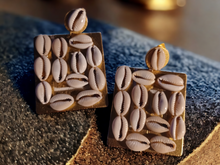 Load image into Gallery viewer, Handmade Abstract wood and cowrie clip on earrings