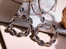 Load image into Gallery viewer, Handmade Hammered silver Metal and cowrie shell Clip On Hoop Earrings