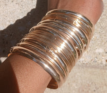 Load image into Gallery viewer, Set of 35 gold metal boho bangles