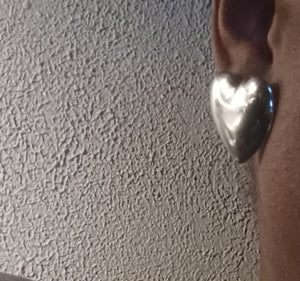 Large Silver heart stud earrings pierced ears