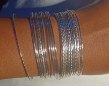 Load image into Gallery viewer, Set of 25 light silver bangles
