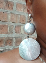 Load image into Gallery viewer, Hand carved aluminum disc clip on earrings  Mali
