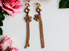 Load image into Gallery viewer, Handmade gold chain and crystal daisy clip on earrings
