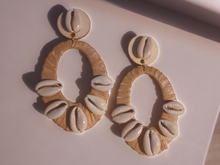 Load image into Gallery viewer, Handmade wood raffia and Cowrie clip on hoops
