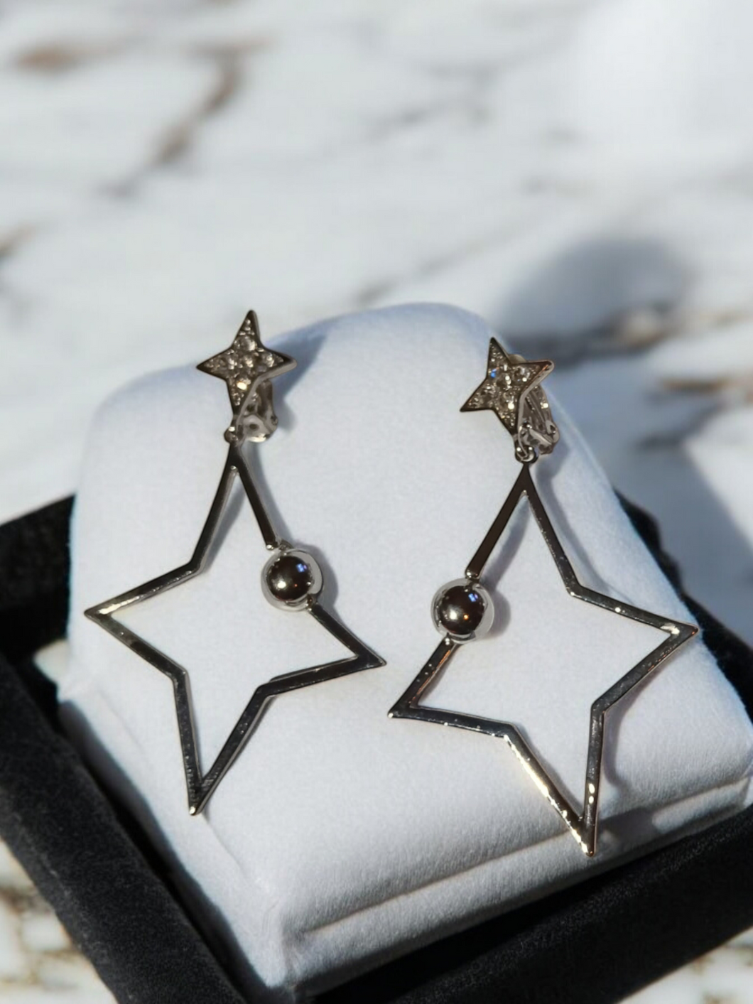 Abstract star design clip on earrings silver