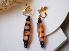 Load image into Gallery viewer, Vintage Bovine handmade Clip on earrings
