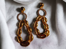 Load image into Gallery viewer, Handmade Gold Metal Hoop and Cowrie Shell Clip On Earrings
