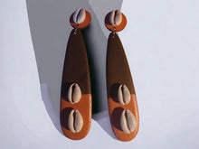 Load image into Gallery viewer, Handmade  handpainted cowrie and Wood Clip On Dangle Earrings 6 inch
