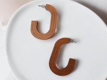Load image into Gallery viewer, Minimalist Wooden Hoop Earrings brown pierced ears
