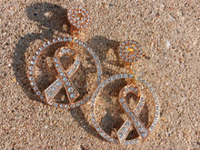 Load image into Gallery viewer, Clip On rhinestone ribbon  Awareness earrings handmade
